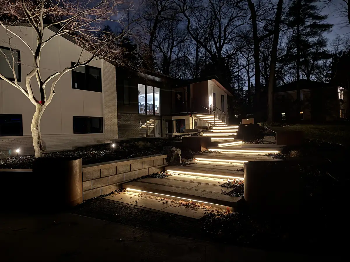 LED step lighting on paver stairs by Earth Art Landscaping
